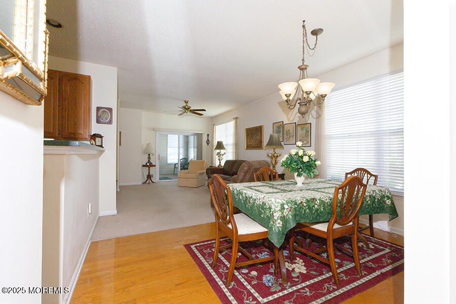 80 Robin Lane Barnegat, NJ 08005 - Photo 7 of 24 a view of a dining room with furniture and chandelier