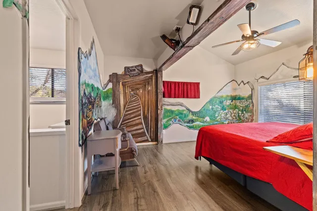 a bedroom with furniture and a bed