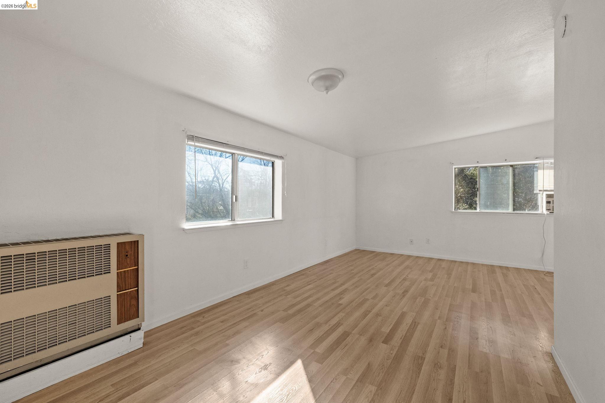 22941 Hudson Road Columbia, CA 95310 - Photo 28 of 34 a view of an empty room with wooden floor and a window