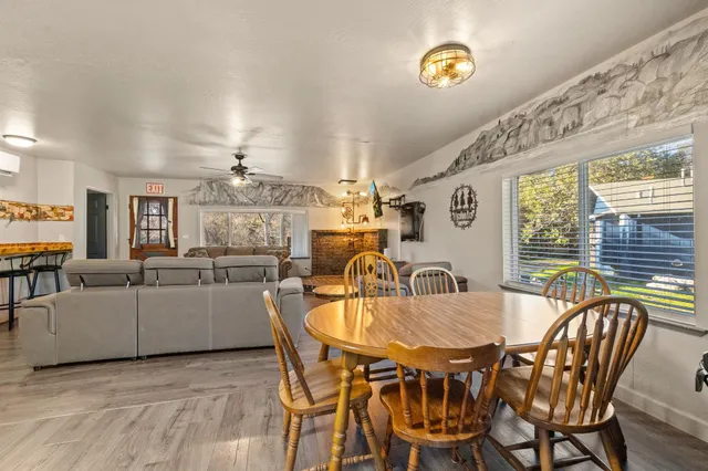a dining room with furniture and window
