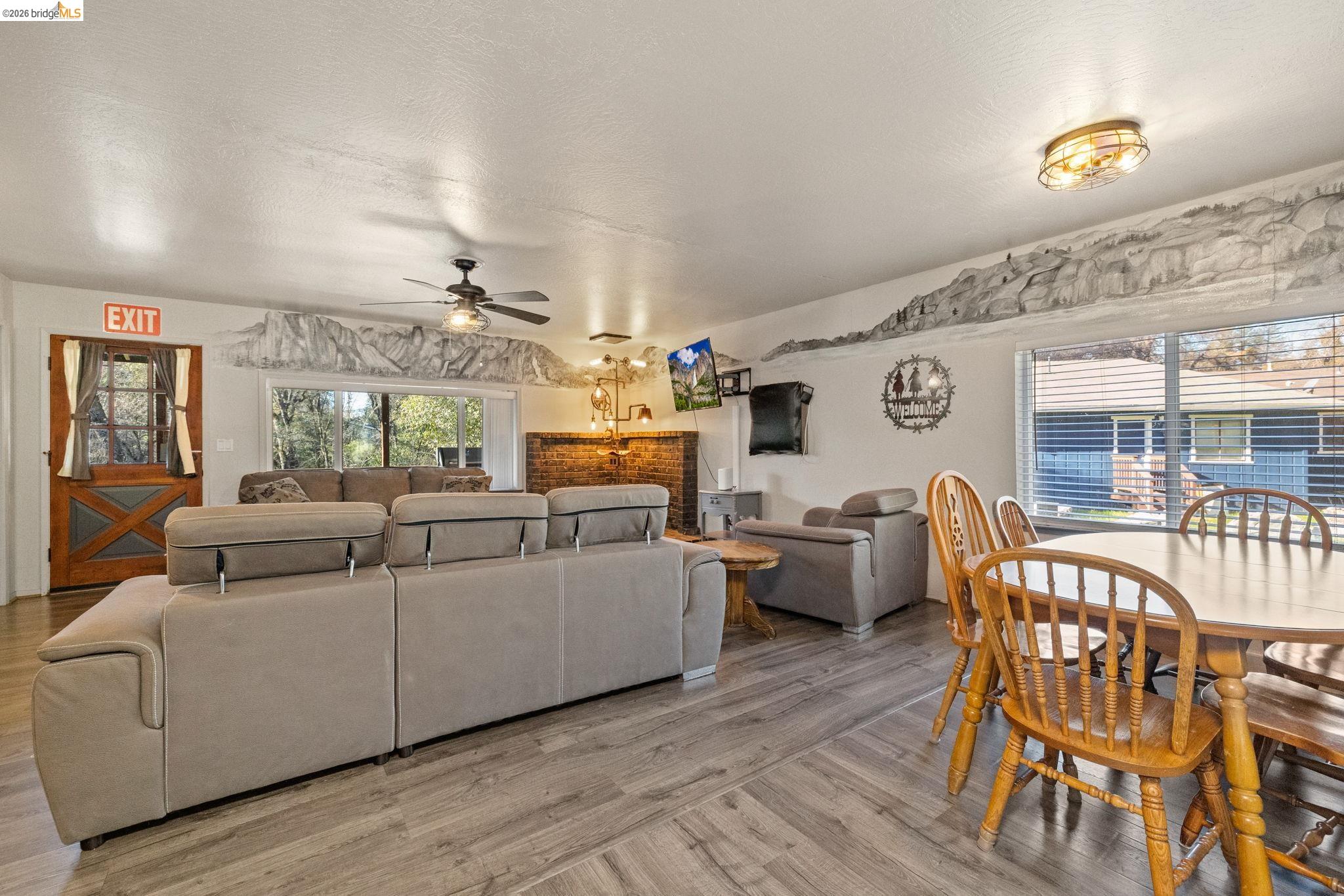 22941 Hudson Road Columbia, CA 95310 - Photo 9 of 34 a living room with furniture and a large window