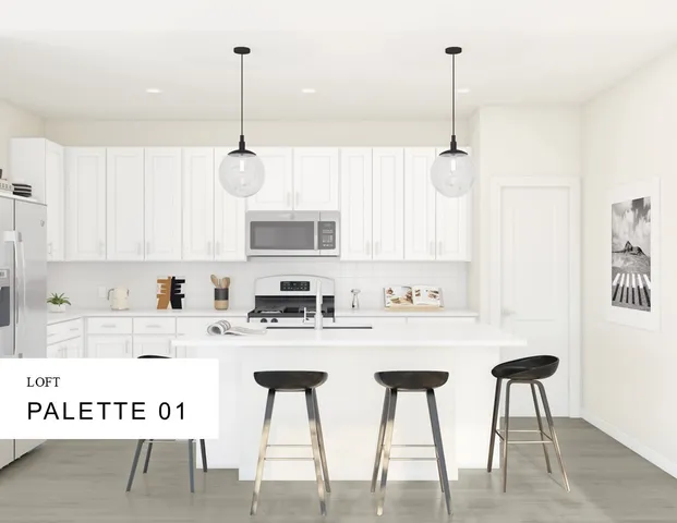 a kitchen with stainless steel appliances kitchen island granite countertop a dining table chairs and white cabinets