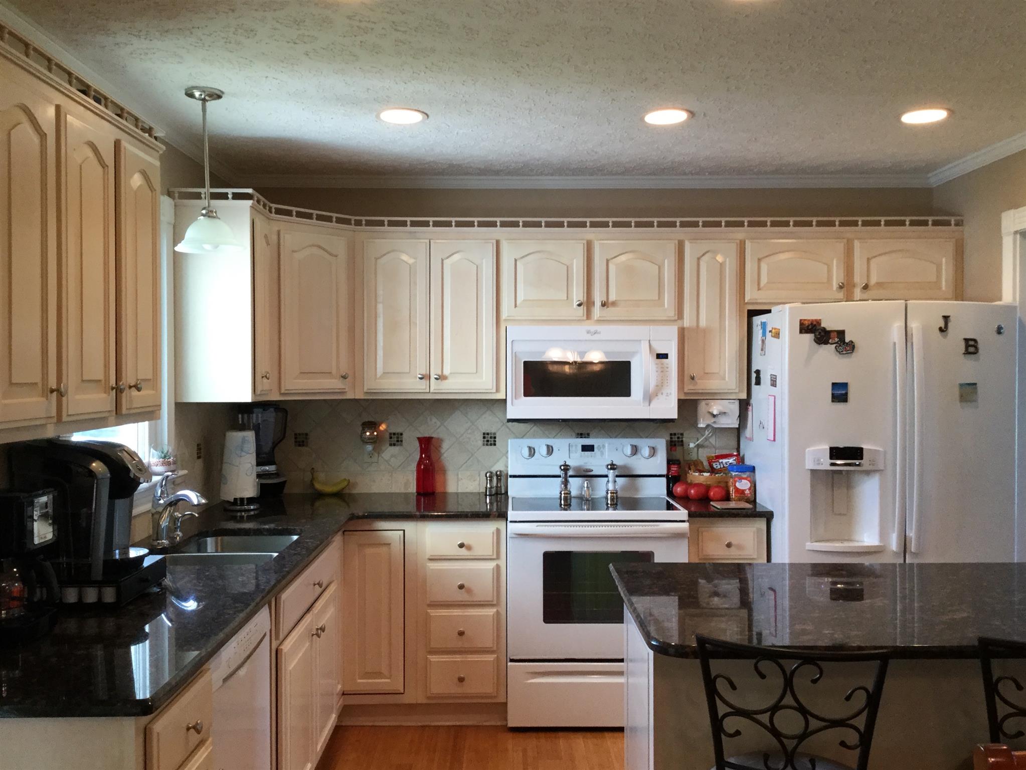 1901 Abiff Road Burns, TN 37029 - Photo 13 of 20 a kitchen with stainless steel appliances granite countertop a refrigerator sink and cabinets