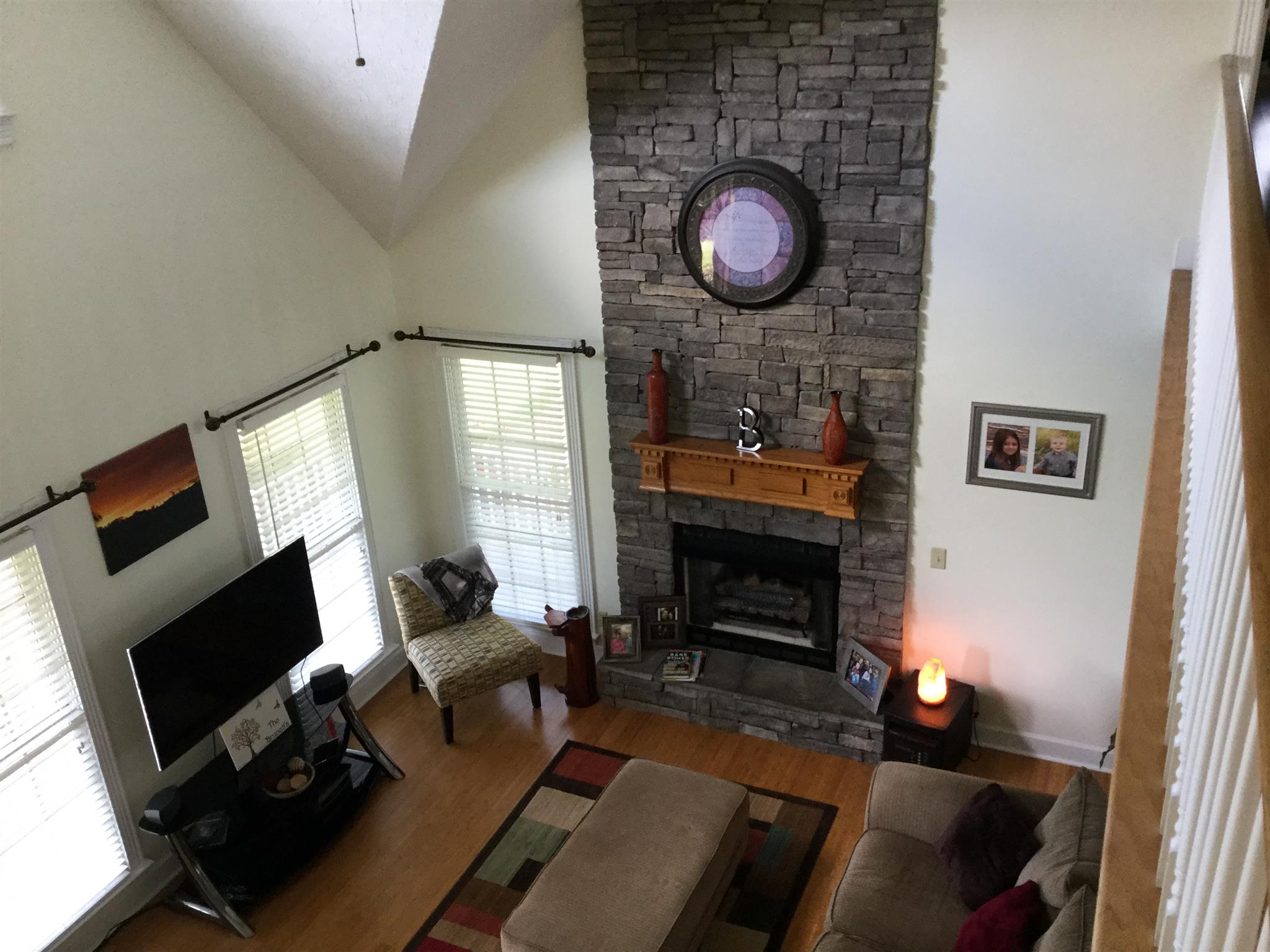 1901 Abiff Road Burns, TN 37029 - Photo 18 of 20 a living room with furniture a fireplace and a flat screen tv