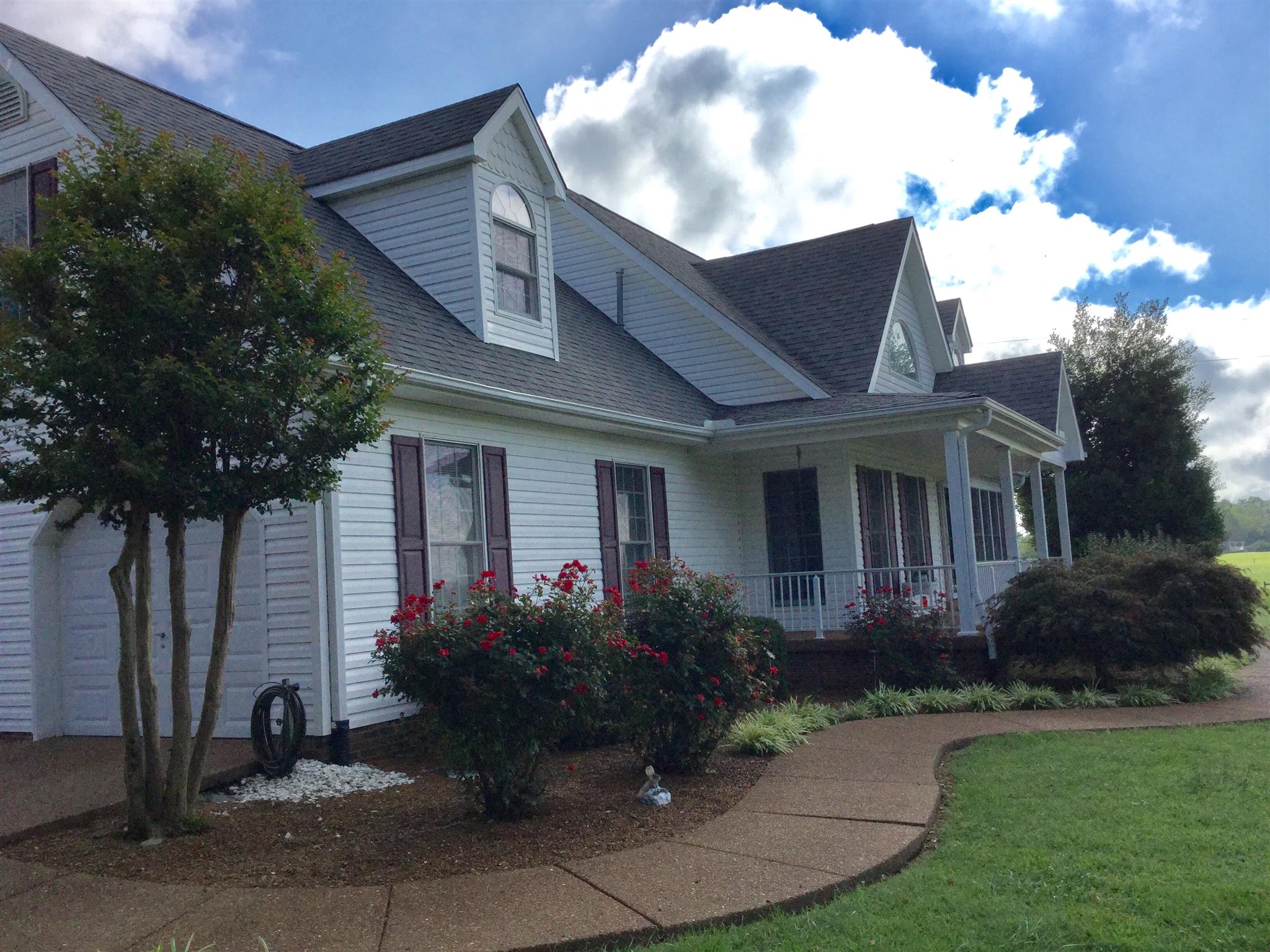 1901 Abiff Road Burns, TN 37029 - Photo 4 of 20 a front view of a house with garden