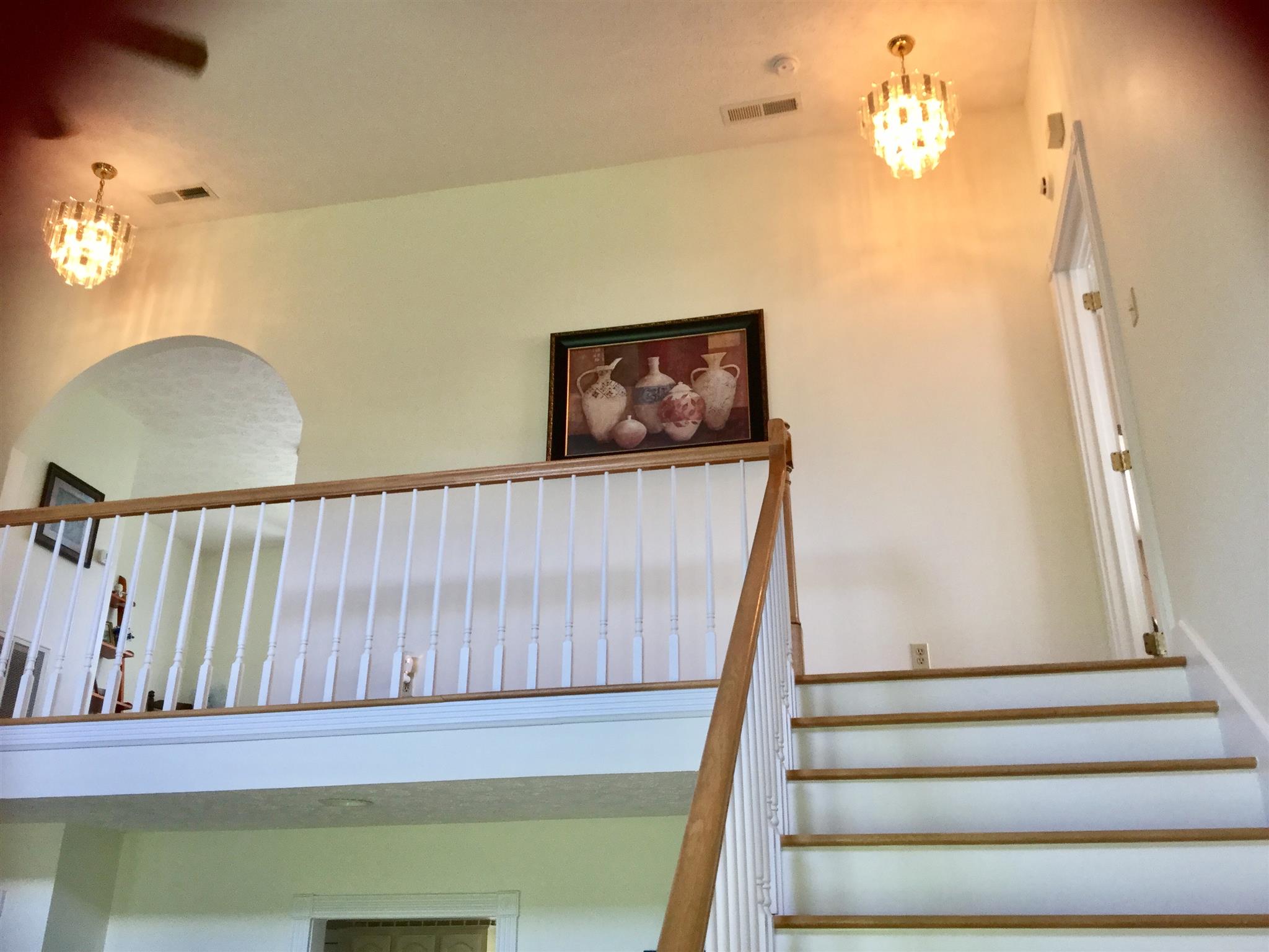 1901 Abiff Road Burns, TN 37029 - Photo 9 of 20 a view of staircase with wooden floor and window