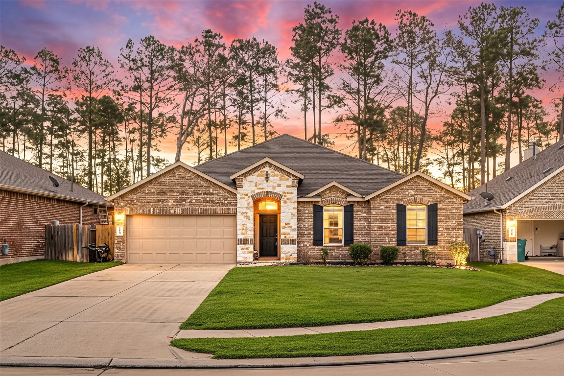 14023 Beaverhead Range Court Conroe, TX 77384 - Photo 1 of 29 Welcome home to 14023 Beaverhead Range Court located on a quiet cul-de-sac street in Fosters Ridge and zoned to Conroe ISD! This stunning home has lovely curb appeal, a well-manicured lawn, beautiful landscaping, stone/brick elevation, dark stained front door, covered front porch, ranch style, dark stained shutters, beautiful outdoor lantern, and a double wide driveway!
