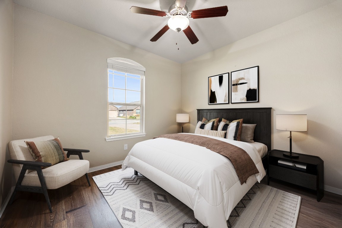 14023 Beaverhead Range Court Conroe, TX 77384 - Photo 17 of 29 A bright and versatile secondary bedroom that offers comfort, style, and flexibility for guests, family members, or even a quiet home office retreat. Featuring ceiling fan, wood flooring, and a large window! *Virtually Staged