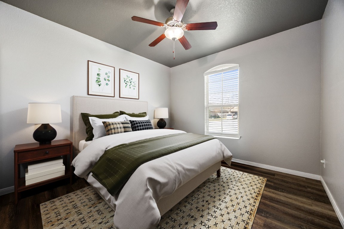 14023 Beaverhead Range Court Conroe, TX 77384 - Photo 18 of 29 Welcome to a serene and stylish secondary bedroom featuring a modern, designer-selected color palette! Featuring wood flooring, ceiling fan, and large window! *Virtually Staged