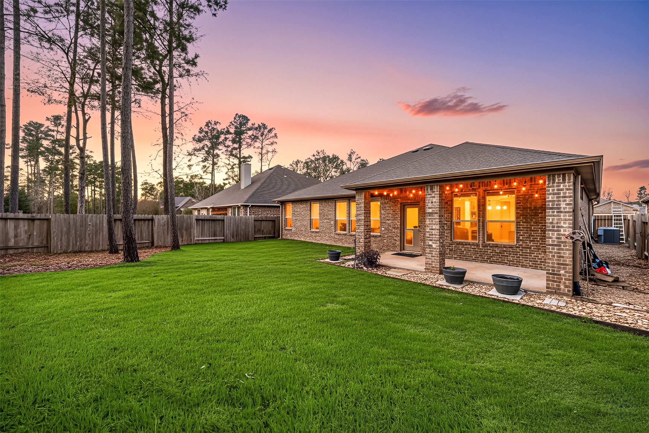 14023 Beaverhead Range Court Conroe, TX 77384 - Photo 25 of 29 a view of a house with backyard and sitting area