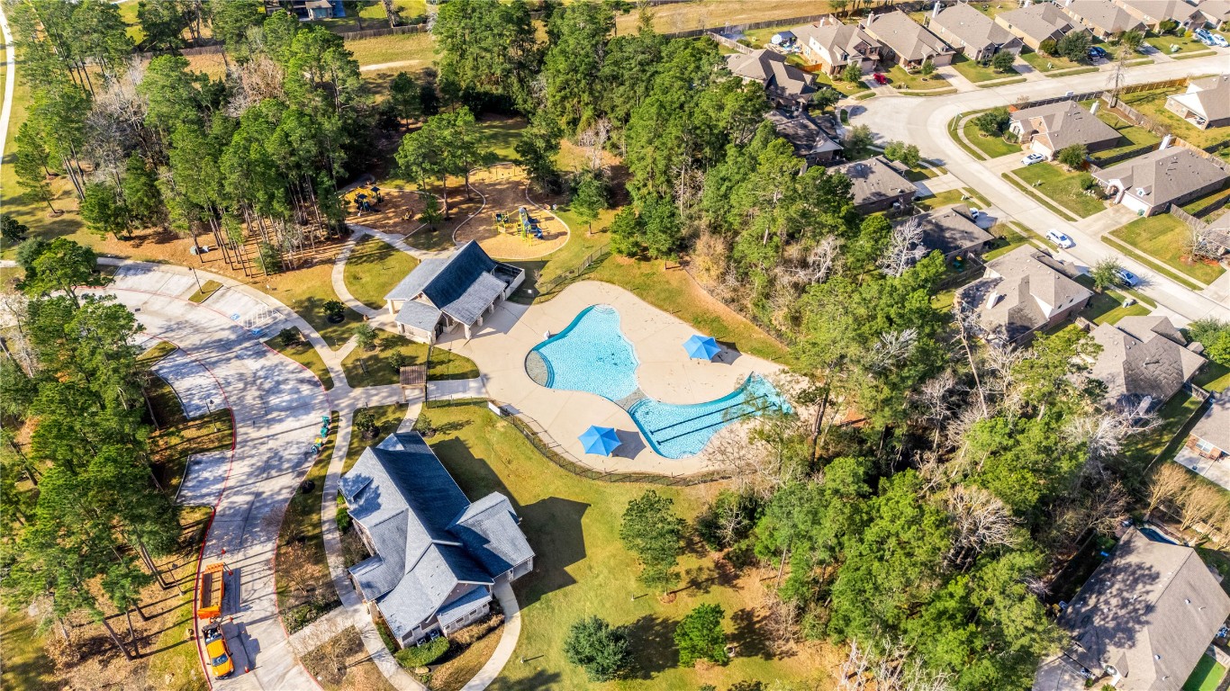 14023 Beaverhead Range Court Conroe, TX 77384 - Photo 27 of 29 Residents of Forest Ridge have access to a variety of on-site amenities, including a recreation center, a community pool, a clubhouse, playgrounds, and walking/hiking/biking trails that are surrounded by nature reserves and private ponds.