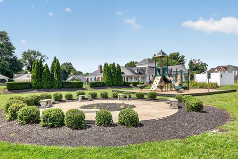 a view of a house with swimming pool and a yard