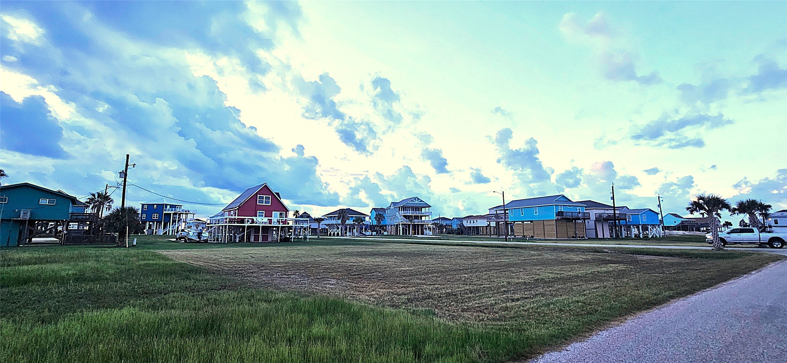 0 Jean Lafitte Drive Freeport, TX 77541 - Photo 2 of 14 a view of street with red and white house