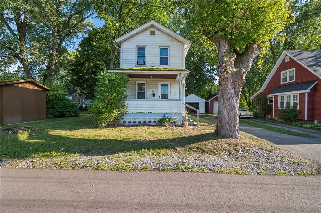 1428 West Ridge Avenue Sharpsville, PA 16150 - Photo 6 of 7 a view of a yard in front of a house with a large tree