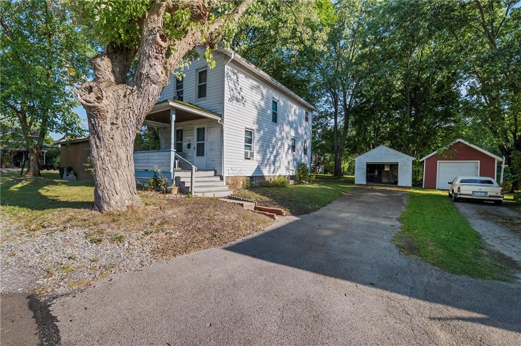 1428 West Ridge Avenue Sharpsville, PA 16150 - Photo 7 of 7 a front view of a house with garden
