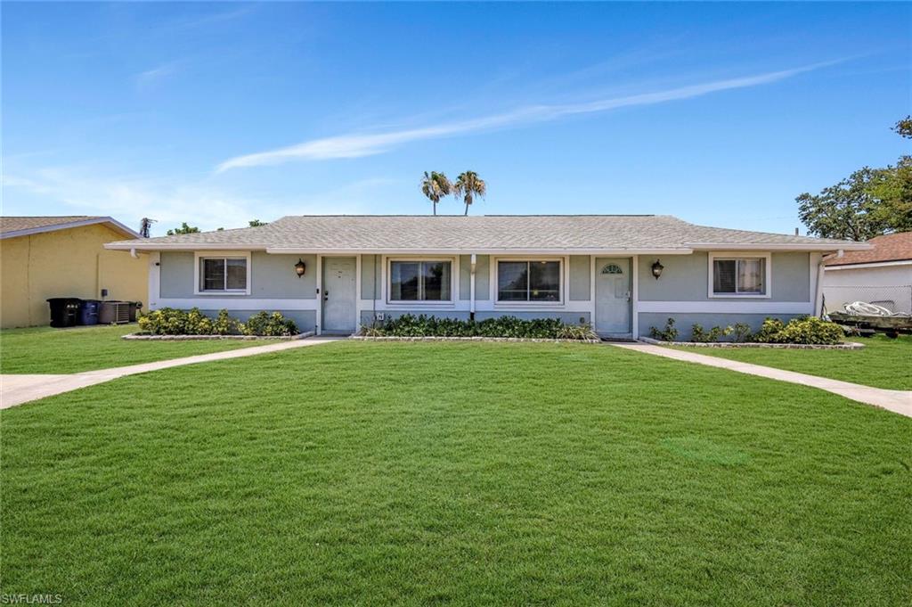 7481-7485 Pebble Beach Road Fort Myers, FL 33967 - Photo 1 of 31 a view of house with a big yard and potted plants