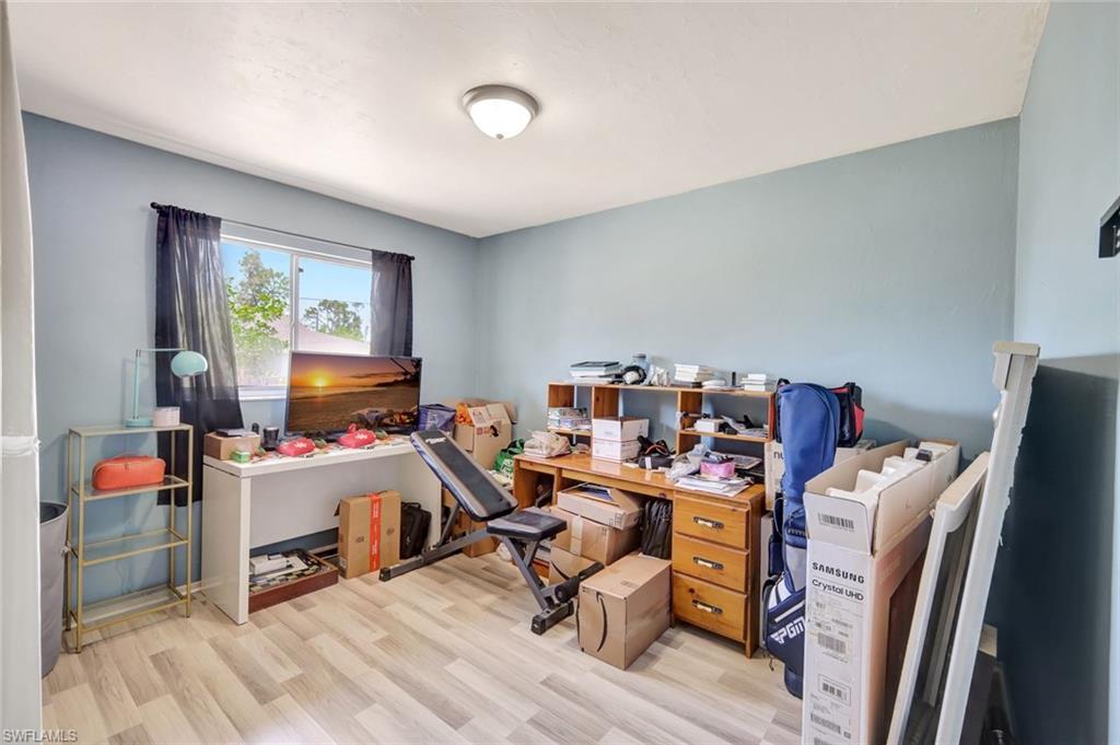 7481-7485 Pebble Beach Road Fort Myers, FL 33967 - Photo 13 of 31 a view of a workspace with furniture and a window