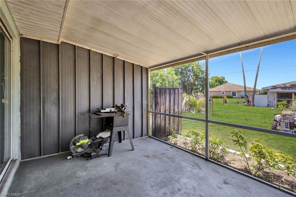 7481-7485 Pebble Beach Road Fort Myers, FL 33967 - Photo 14 of 31 a view of a porch with furniture and garden