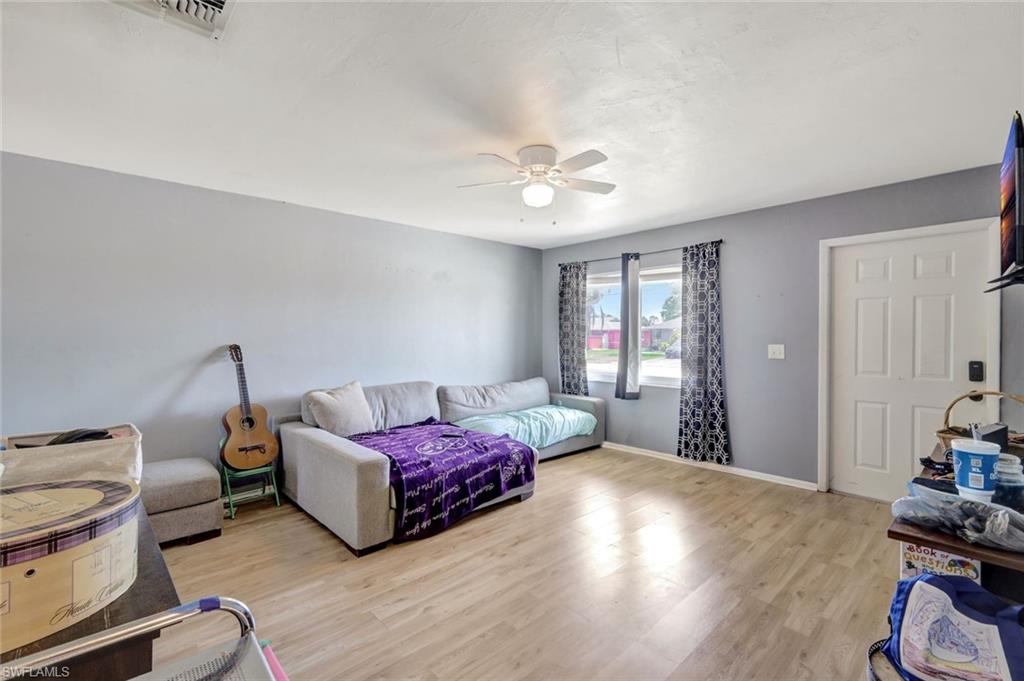 7481-7485 Pebble Beach Road Fort Myers, FL 33967 - Photo 20 of 31 a spacious bedroom with a bed and a window