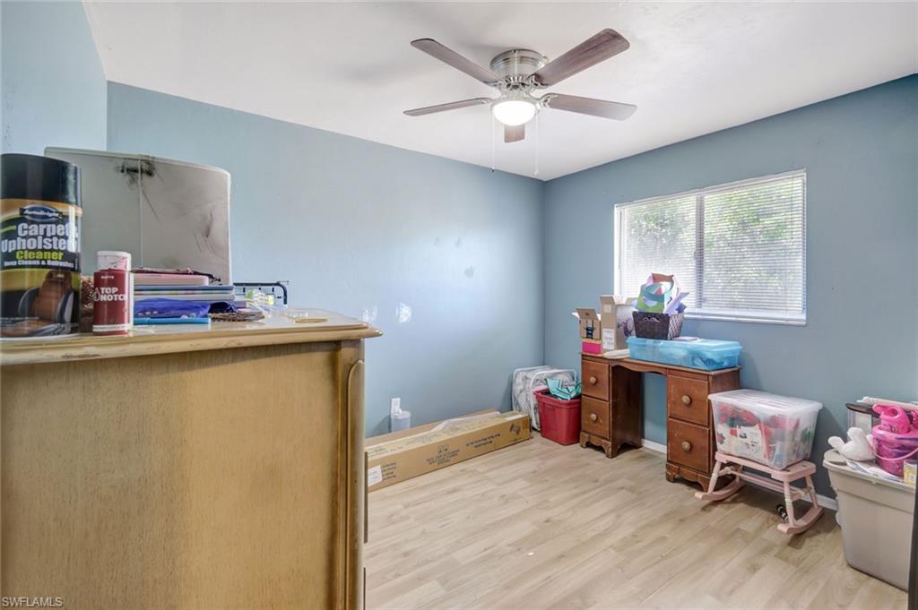 7481-7485 Pebble Beach Road Fort Myers, FL 33967 - Photo 28 of 31 a workspace with furniture and window