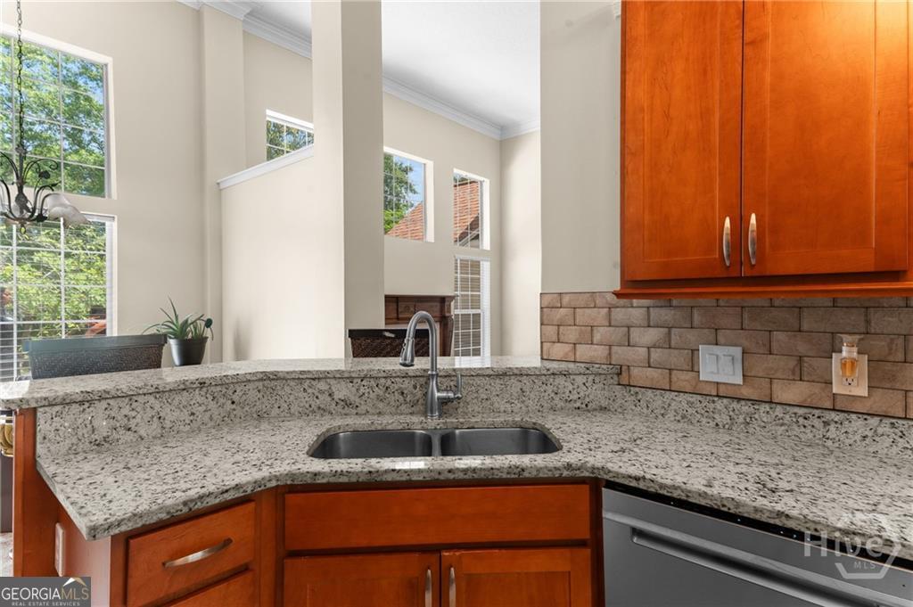 10 Fox Hound Court Pooler, GA 31322 - Photo 13 of 32 a kitchen with stainless steel appliances granite countertop a sink and a granite counter tops