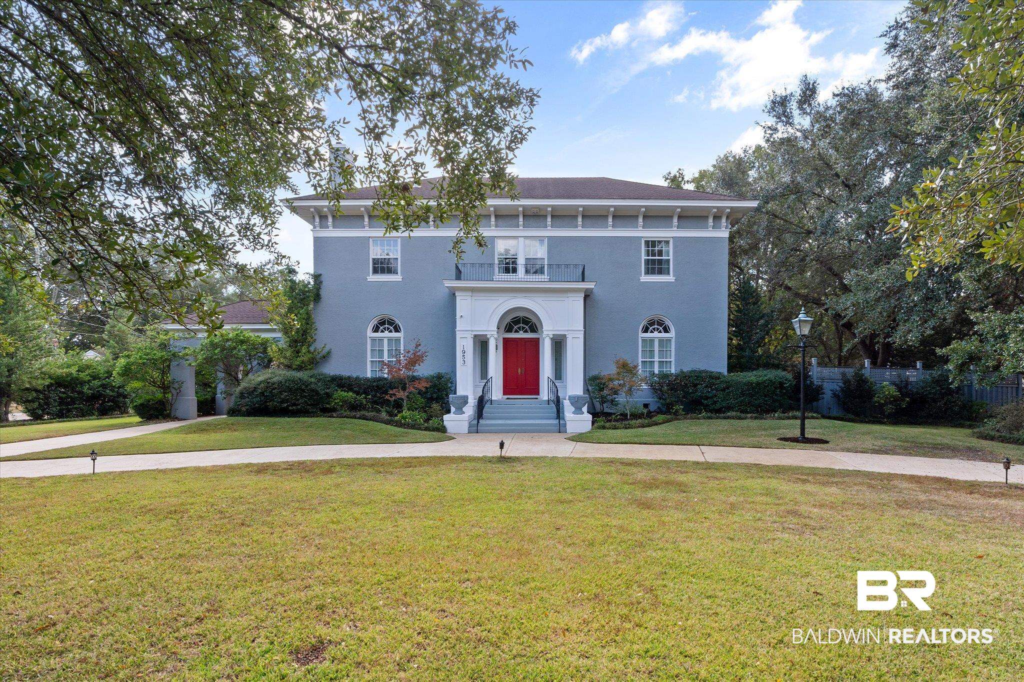 1953 Dauphin Street Mobile, AL 36606 - Photo 1 of 56 Italianate-style house featuring a balcony and a front yard