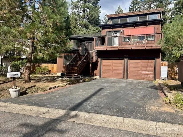 a front view of a house with parking area