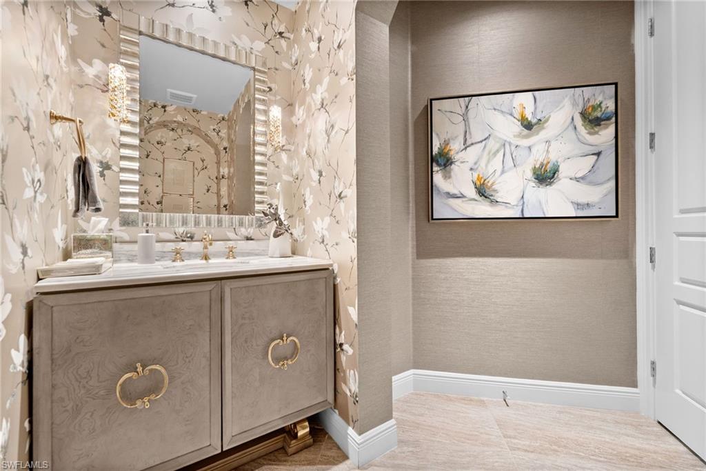 16436 Carrara Way, Unit 102 Naples, FL 34110 - Photo 28 of 43 Bathroom featuring vanity and baseboards