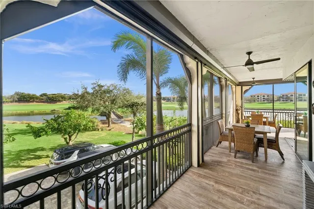 a view of a porch with furniture and wooden floor