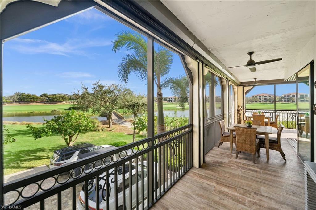 16436 Carrara Way, Unit 102 Naples, FL 34110 - Photo 34 of 43 Sunroom featuring a water view, ceiling fan, outdoor dining space, a balcony, and view of golf course