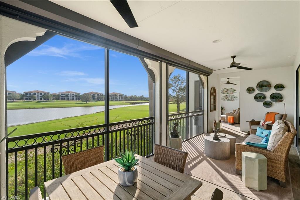 16436 Carrara Way, Unit 102 Naples, FL 34110 - Photo 35 of 43 Sunroom featuring a water view, a ceiling fan, and golf course view