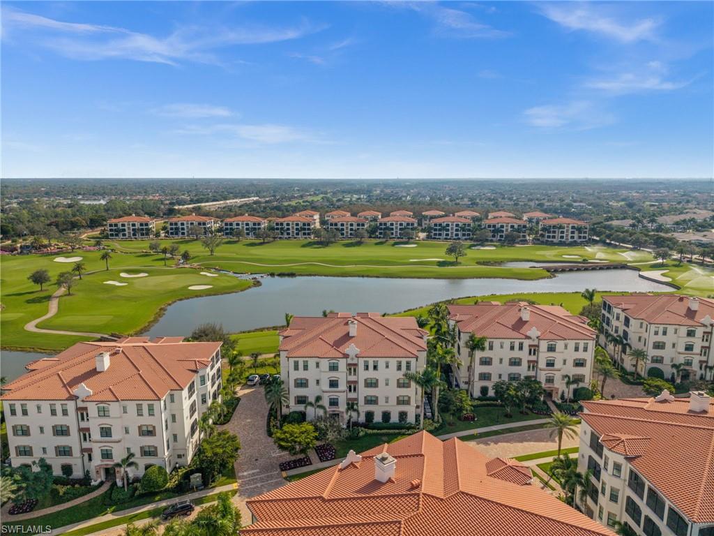 16436 Carrara Way, Unit 102 Naples, FL 34110 - Photo 39 of 43 Aerial view of a local golf course and a large body of water