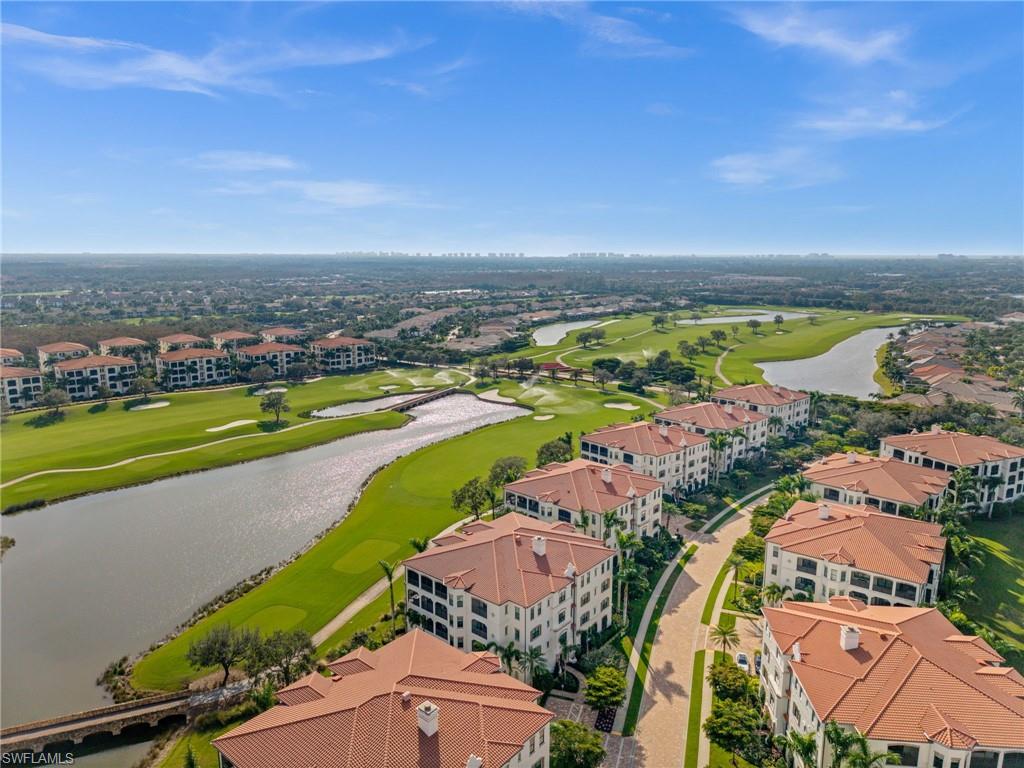 16436 Carrara Way, Unit 102 Naples, FL 34110 - Photo 40 of 43 Aerial view of a large body of water and a local golf course