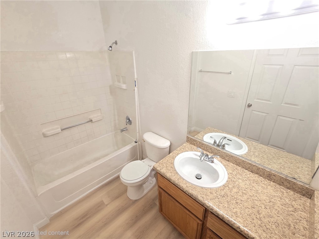 4730 East Craig Road, Unit 1062 Las Vegas, NV 89115 - Photo 3 of 8 A well-appointed bathroom with a vanity, sink, and a combination shower and tub.