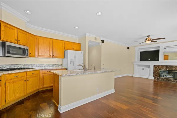 a kitchen with stainless steel appliances granite countertop a sink and cabinets