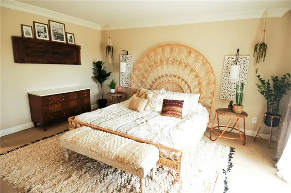 a bedroom with a bed and a television