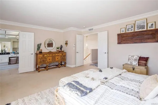 a bedroom with a bed and a couch