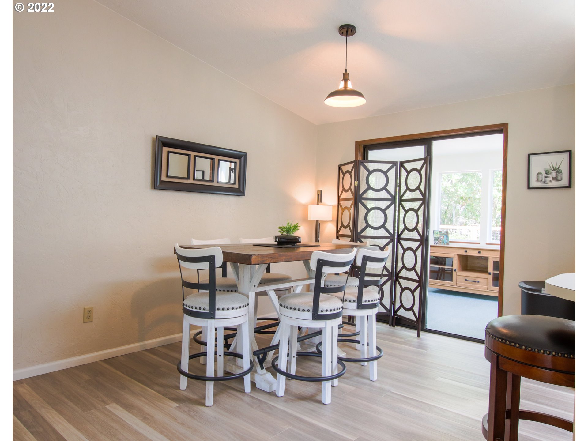 2187 12th Street Florence, OR 97439 - Photo 14 of 30 a view of a dining room with furniture window and wooden floor