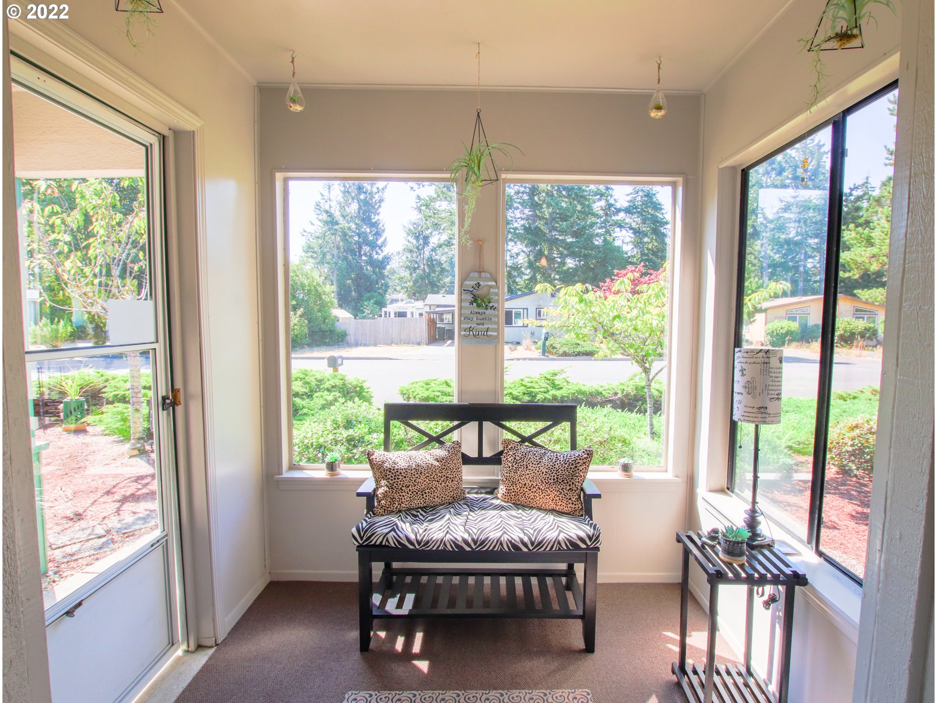 2187 12th Street Florence, OR 97439 - Photo 15 of 30 a living room with furniture and a floor to ceiling window