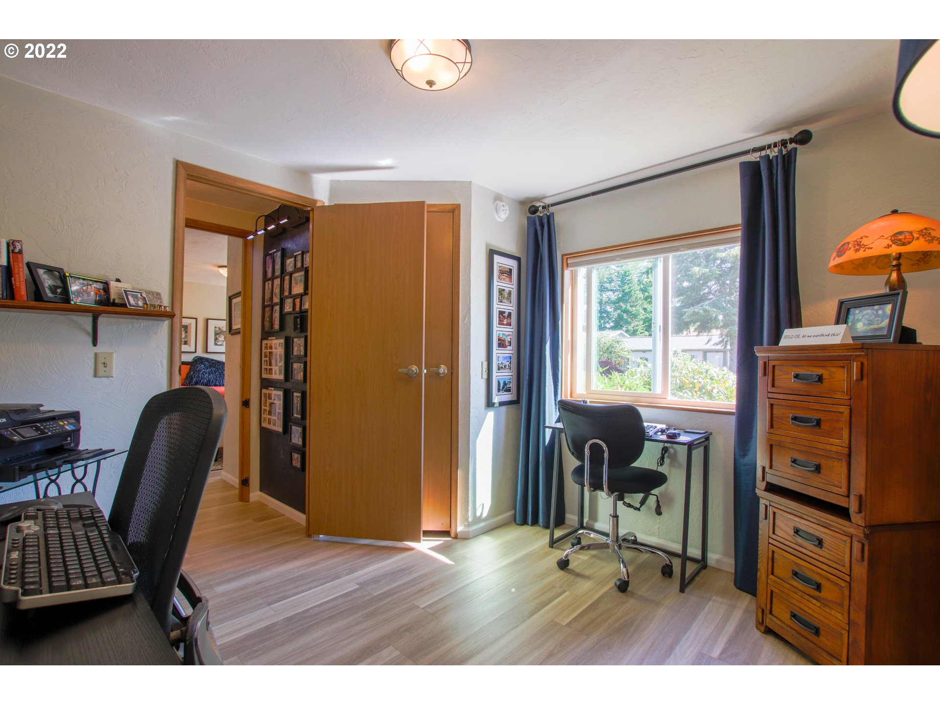 2187 12th Street Florence, OR 97439 - Photo 25 of 30 a view of a workspace with furniture and a window