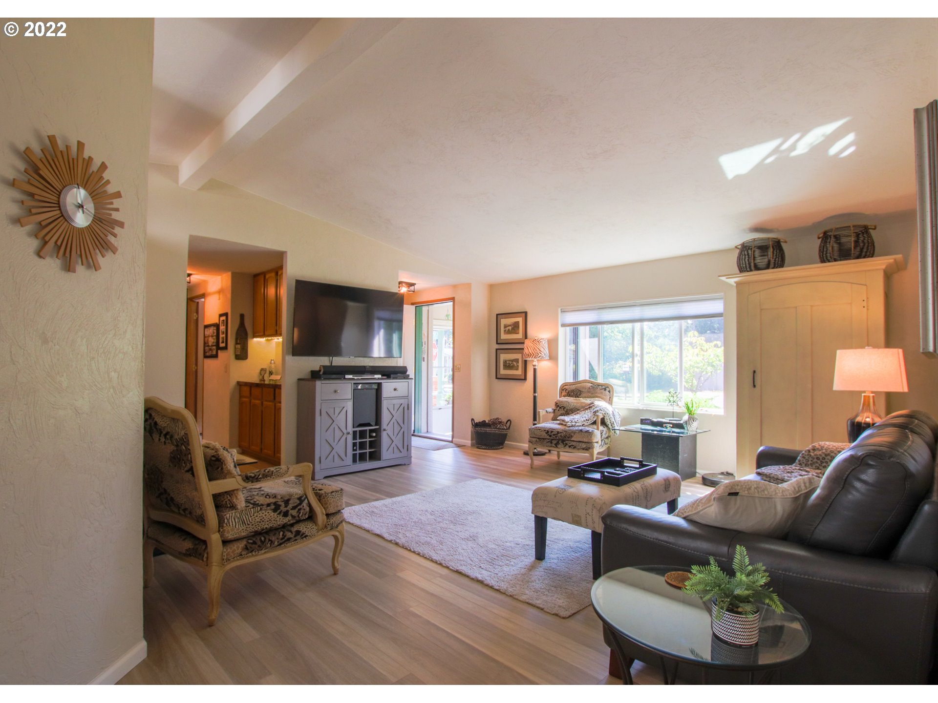 2187 12th Street Florence, OR 97439 - Photo 8 of 30 a living room with furniture a dining table and a large window