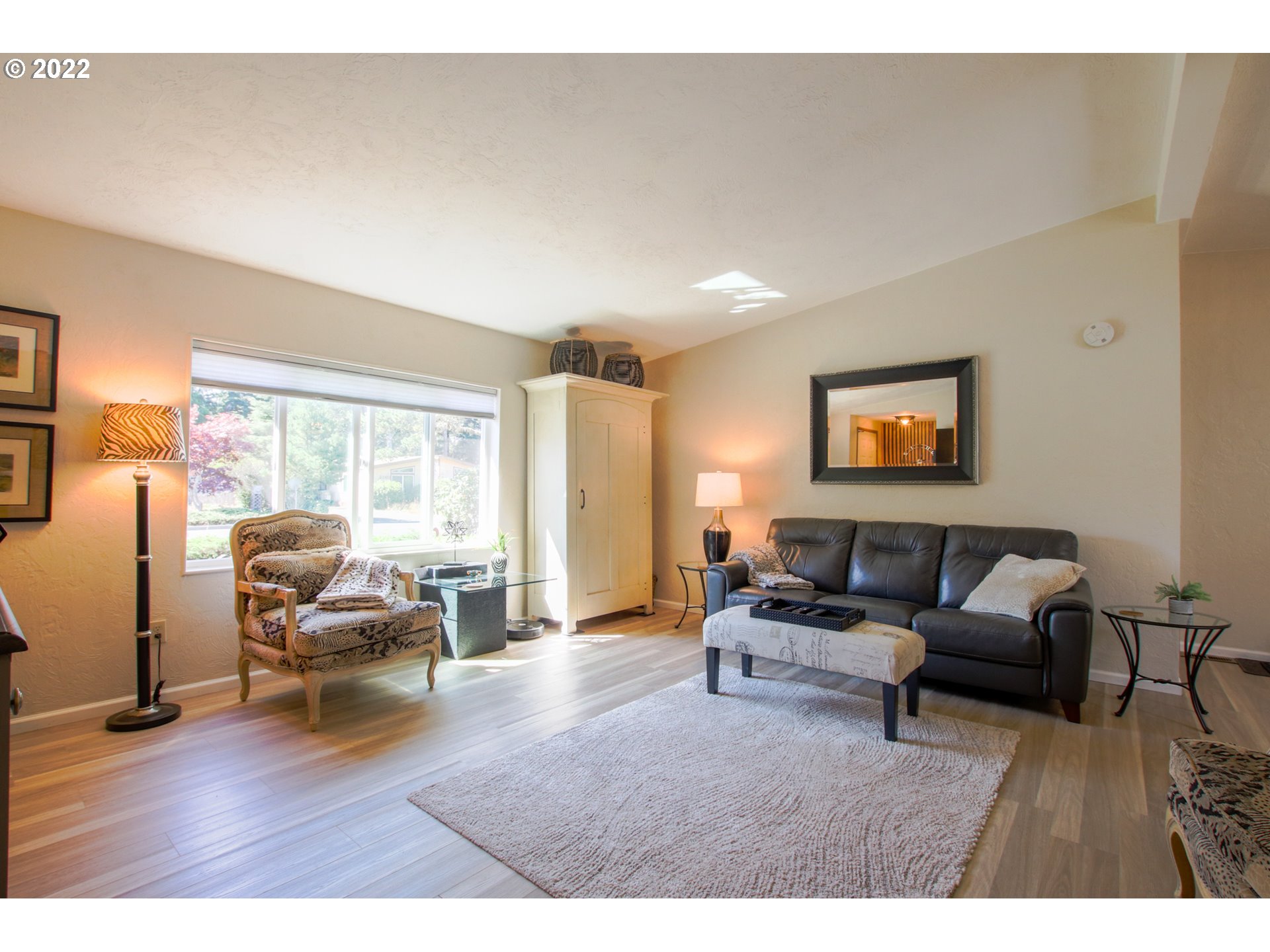 2187 12th Street Florence, OR 97439 - Photo 10 of 30 a living room with furniture and a flat screen tv
