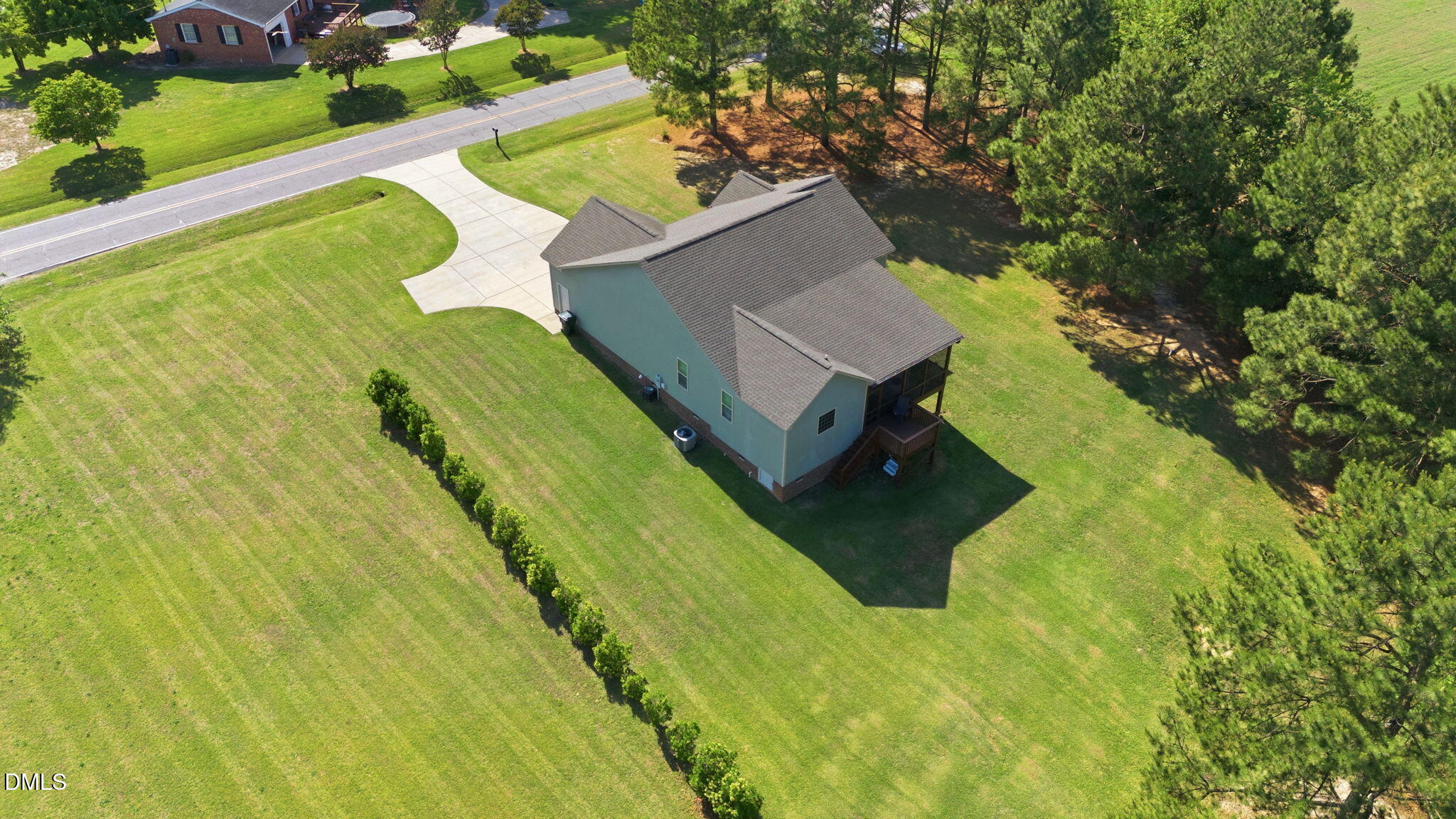 1547 Lassiter Pond Road Four Oaks, NC 27524 - Photo 6 of 45 an aerial view of a house with swimming pool and large trees