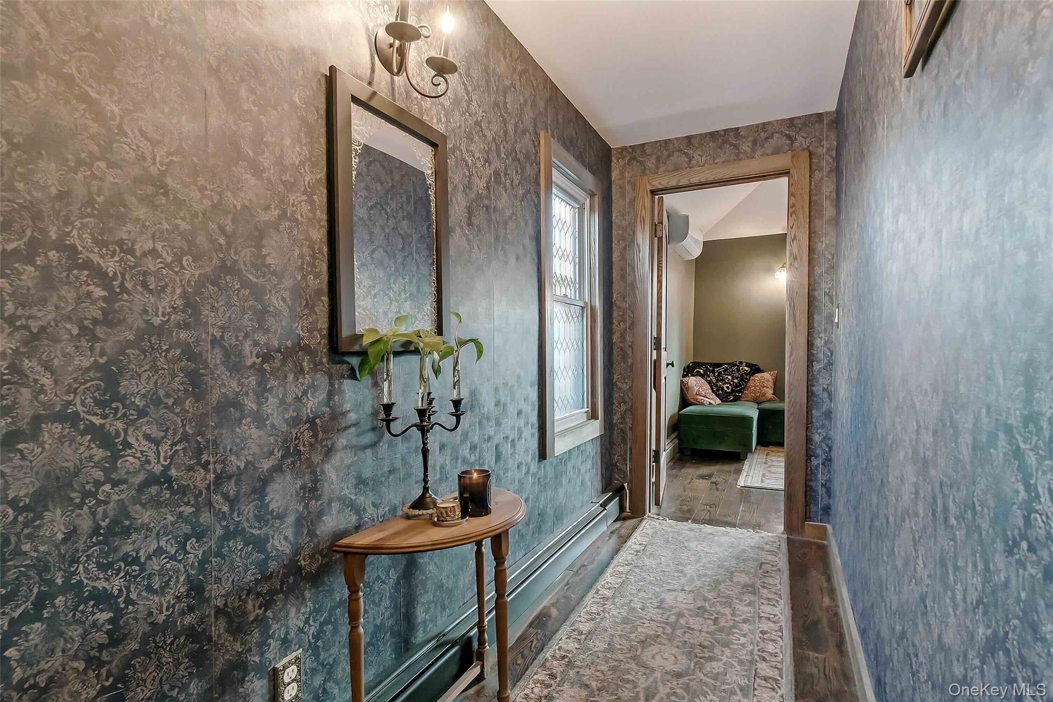 27 West 11th Road Queens, NY 11693 - Photo 14 of 18 Corridor with wood finished floors and wallpapered walls