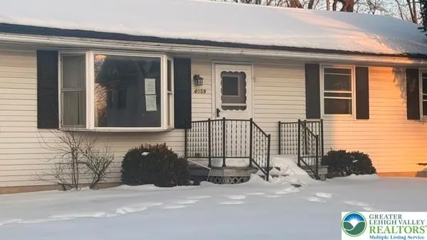 a front view of a house with a garage
