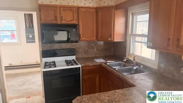 4059 Mauch Chunk Road Coplay, PA 18037 - Photo 14 of 37 a kitchen with a sink stove and microwave