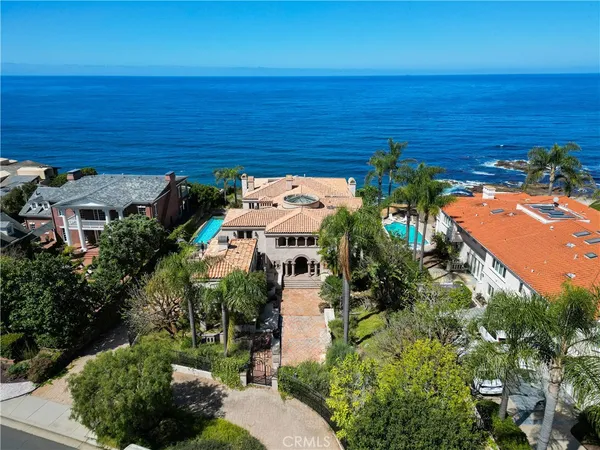 a aerial view of a house with a yard
