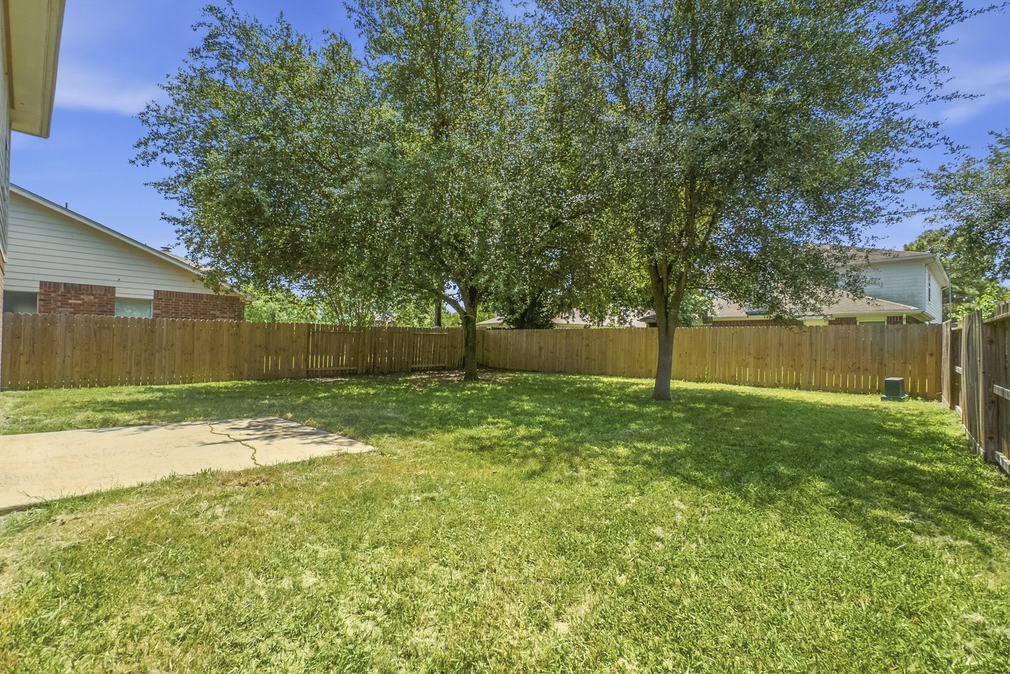 11907 Ezekiel Road Tomball, TX 77375 - Photo 36 of 39 a backyard of a house with lots of green space