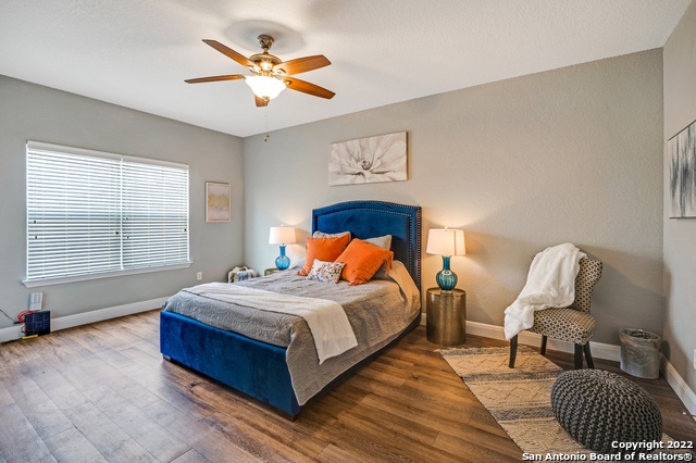 223 Rudolph San Antonio, TX 78202 - Photo 11 of 24 a bedroom with a bed and a chandelier