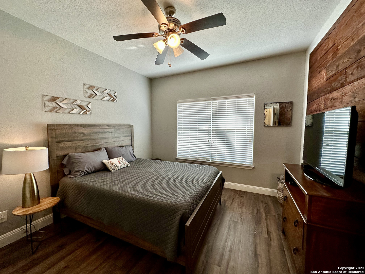 223 Rudolph San Antonio, TX 78202 - Photo 13 of 24 a bedroom with a bed and a flat tv screen on dresser